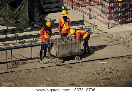 A Construction Worker Do A Job Such As Painting Welding In A Construction Site.