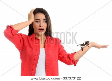 Scared Young Woman With Tarantula On White Background. Arachnophobia (fear Of Spiders)