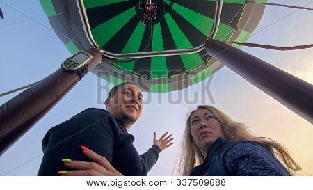Adventure Love Couple On Hot Air Balloon Watermelon. Man And Woman Kiss Hug Love Each Other. Burner 
