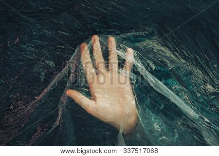 Beautiful Abstract Plastic Cellophane  Bag Background. Human Hand Shows Palm Help Stop.  No Plastic 