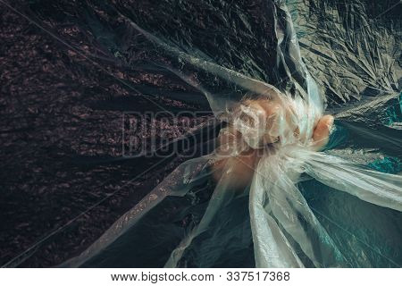 Beautiful Abstract Plastic Cellophane  Bag Background. Human Hand Shows Palm Stop.  No Plastic Bag C