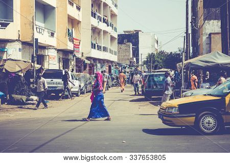Dakar, Senegal - November 11, 2019: People Working And Traffic At Senegal Capital Dakar, West Africa