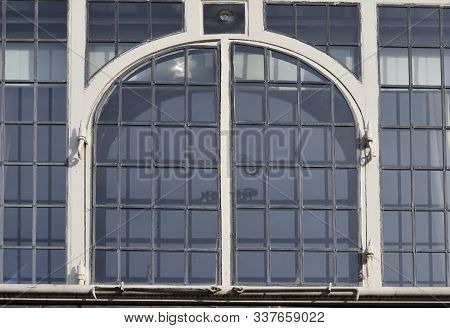 Old Arched Window With White Painted Wooden Frame And Leaded Glass In Canterbury, England