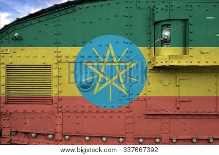 Ethiopia Flag Depicted On Side Part Of Military Armored Tank Closeup. Army Forces Conceptual Backgro