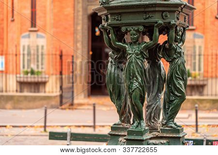 Antique Wallace Fountains With Drinking Water. Women Group Sculpture. Paris. Autumn.