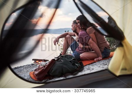 View From Tent Of Couple Lying A View Of Lake During Hiking Trip. Avel Lifestyle Concept Adventure V