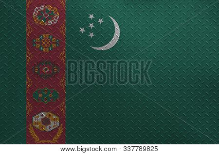 Turkmenistan Flag Depicted In Paint Colors On Old Brushed Metal Plate Or Wall Closeup. Textured Bann