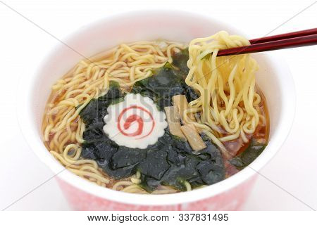 Instant Noodles In Cup With Chopsticks. Isolated On White