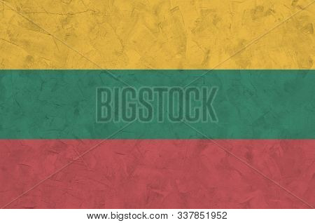 Lithuania Flag Depicted In Bright Paint Colors On Old Relief Plastering Wall. Textured Banner On Rou