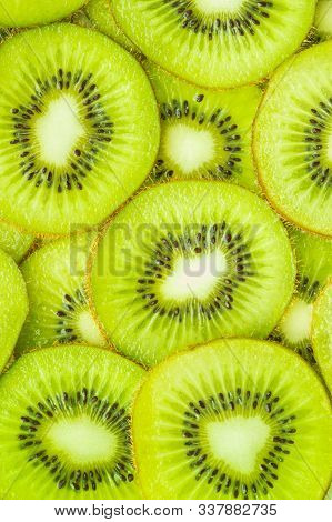 Vertical Image, Flat Lay Of Kiwi Slices. Food Concept, Natural Background.