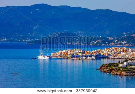 Four-masted Passenger Sailboat Off The Coast Of Agios Nikolaos, Crete, Greece