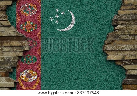 Turkmenistan Flag Depicted In Paint Colors On Old Stone Wall Closeup. Textured Banner On Rock Wall B