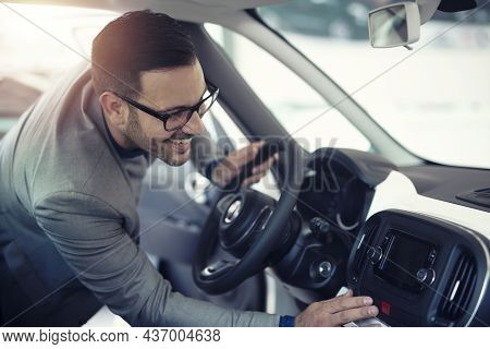 Well Dressed Handsome Businessman Liking Car Interior And Checking New Infotainment System Of Brand 
