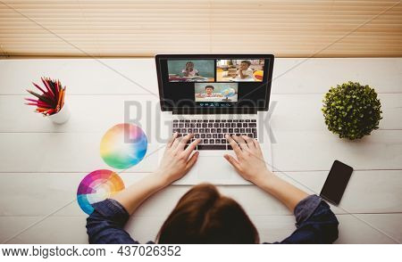 Caucasian woman using laptop for video call, with diverse elementary school pupils on screen. communication technology and online education, digital composite image.