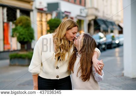 Young Mother And School Preteen Girl Making Walk In The City. Happy Family, Woman And Daughter With 