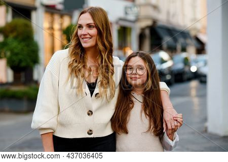 Young Mother And School Preteen Girl Making Walk In The City. Happy Family, Woman And Daughter With 