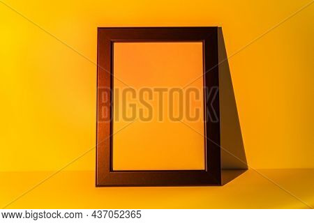 Blank picture frame with yellow sunset projector lamp