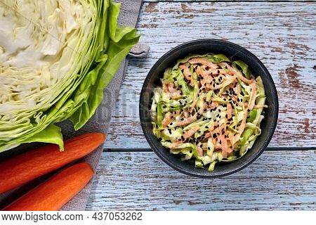 Healthy Vegetarian Food. Coleslow. White Cabbage And Carrot Salad With Black Cumin Seeds And Dressin