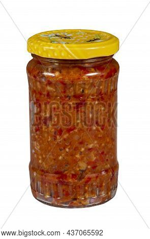 Jar With Vegetable Zacusca Isolated On White Background. Zacusca Is A Traditional Romanian Dish.