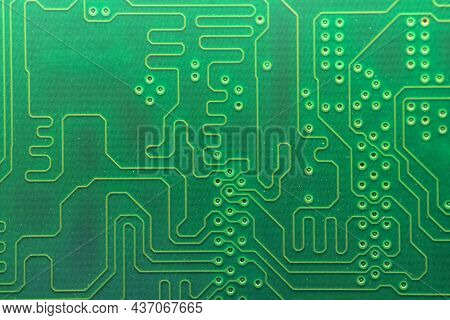 Close Up Of A Used Printed Green Electronic Circuit Board With Dust