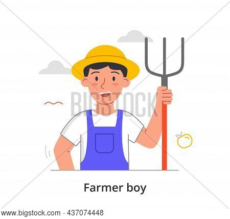 Farmer Boy Concept. Small Child Holds Rake In His Hand To Collect Leaves And Dried Grass. Character 