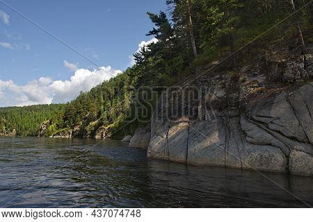 Russia. Chita Region. Coastal Rocks On The Burkal River, Whose Fast Waters Tend To The Selenga River