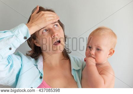 Tired Mom Trying To Calm Her Crying Infant Baby On Hands. Newborn Tantrum. Motherhood Concept. Depre