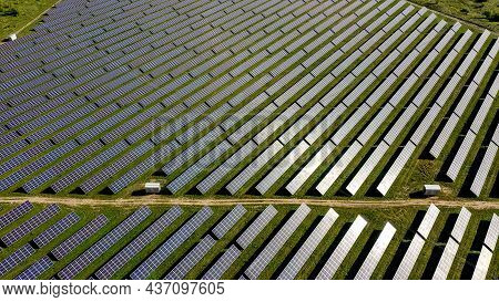 Solar Panels In Aerial View. Power Farm Producing Clean Energy.