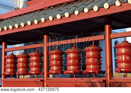 Elista, Russia - September 21, 2021: Prayer Buddhist Drumsg. Syakusn-syume Buddhist Temple. Environs