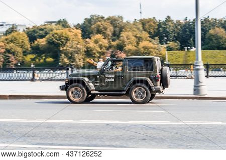 Jeep Wrangler Jl At The City Street Riding On High Speed. 2-door Suv Wrangler Sahara On Street In Mo