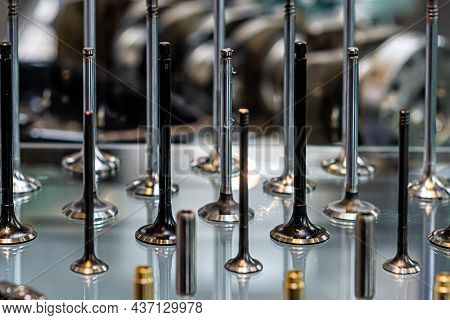 Abstract Background With Car Engine Valves In A Glass Showcase, Close-up