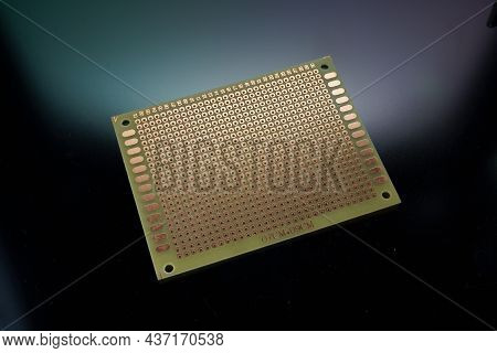 Empty Clear Universal Prototype Printed Circuit Board On Background
