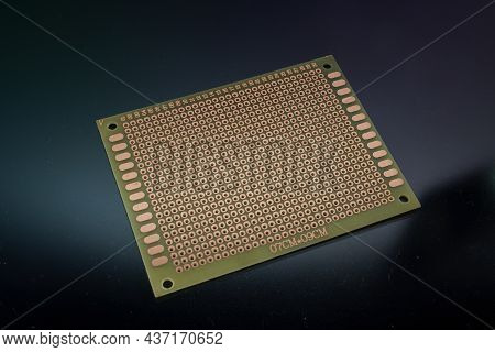 Empty Clear Universal Prototype Printed Circuit Board On Background