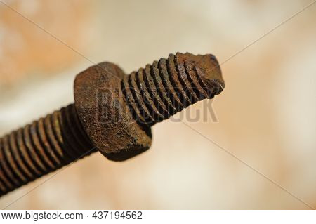 Old Rusty Bolt, Iron Rod With Screw Threads. Rusted Mechanical Components. Threaded Bolt And Nut Iso