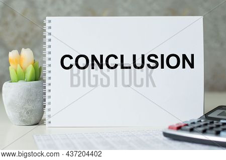 Conclusion Text On Notepad On The Table
