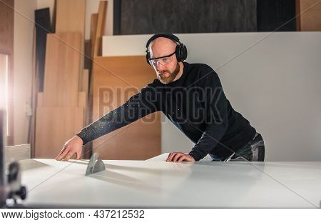 Joinery, Woodworking And Furniture Making, Professional Carpenter Cutting Wood In The Carpentry Shop
