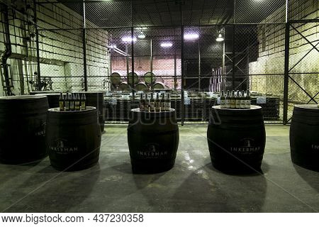 Inkerman.crimea.may 31, 2021.oak Barrels With Wine In The Cellars Of The Inkerman Winery In The Crim