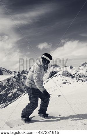 Snowboarder Downhill On Snowy Ski Slope In High Mountains At Sunny Winter Day. Caucasus Mountains, R
