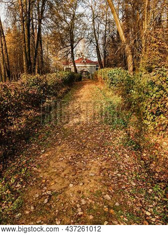 Odintsovo, Russia - October 14, 2020. Path Through Autumn Park To Main Building Of Zakharovo Manor.