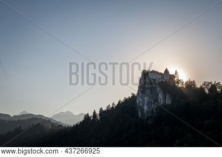 Selective Blur On The Bled Castle, Also Called Blejski Hrad, During Summer, At Sunset, By The Mounta