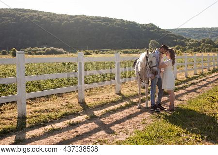 Couple Walk At The Ranch During Summer Day
