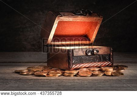 Old Wooden Chest With Coins On The Table, Chest Open, Bright Light Inside, Concept Of Fairy Tale, My