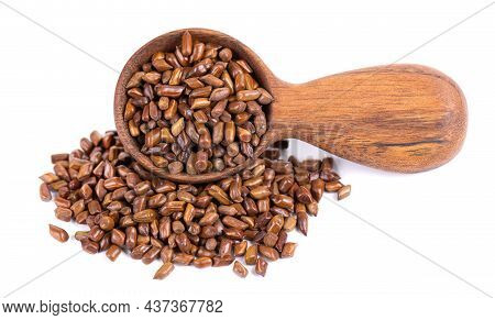 Cassia Tora Beans In Wooden Spoon, Isolated On White Background. Sicklepod Or Senna Obtusifolia. Cli