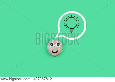 Character From A Pebble With A Happy Face And A Burning Light Bulb In His Mind. Сharacter From The P
