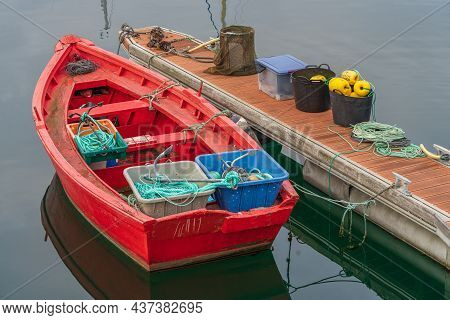 Red Boat And Fishing Tackle In The Port Of The Galician City Of A Coruna, In Galicia, Spain.