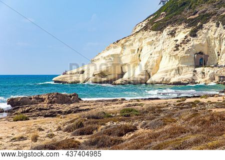 Entrance to the famous karst grottoes. Israel's northern border with Lebanon. Picturesque limestone mountain Rosh - ha - Nikra. Storm on the Mediterranean