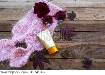 Sunscreen Spf50 Cosmetics Health Care For Skin Face With Sunglasses, Knitting Scarf And Meple Leaf O