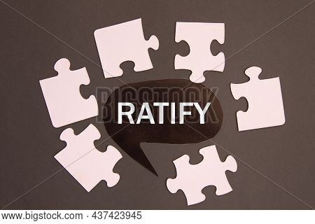Ratify - Word On A Black Note Against The Background Of White Puzzles. Info Concept