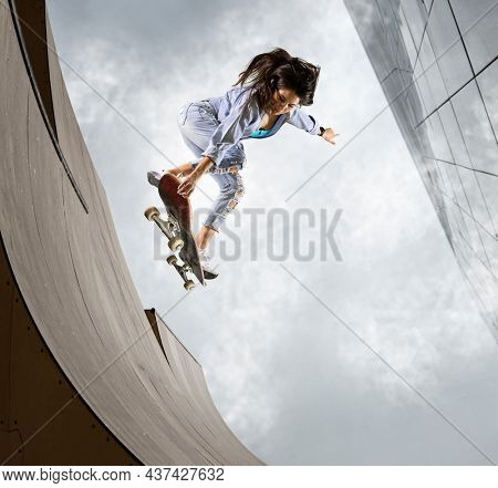 Skater doing kickflip on the ramp. Freestyle extreme sports concept