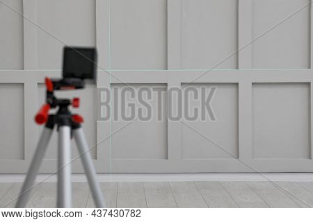 Cross Lines Of Laser Level On Light Wall Indoors